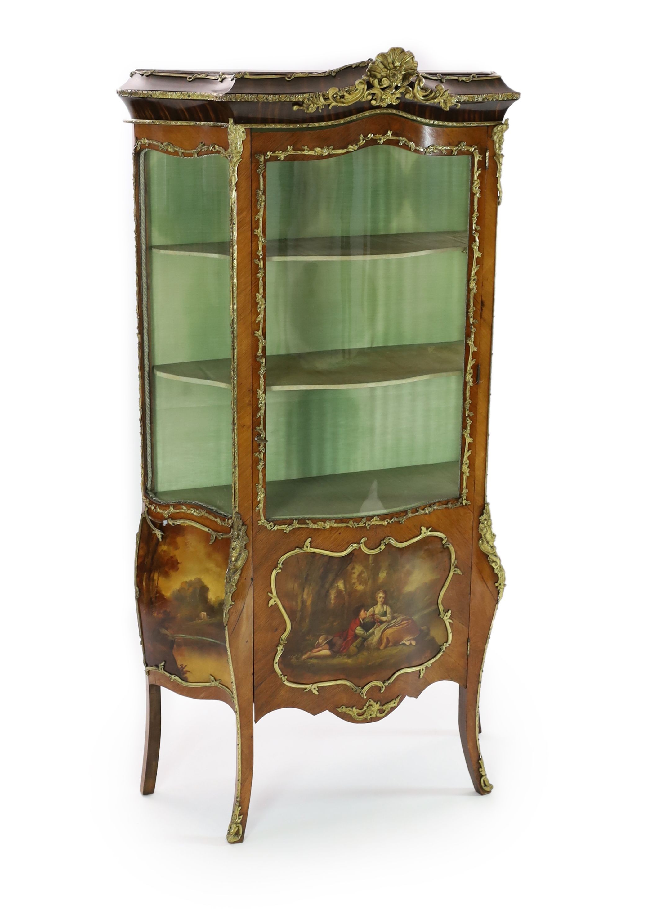 A French gilt metal mounted kingwood serpentine vitrine, W.108cm D.36cm H.193cm